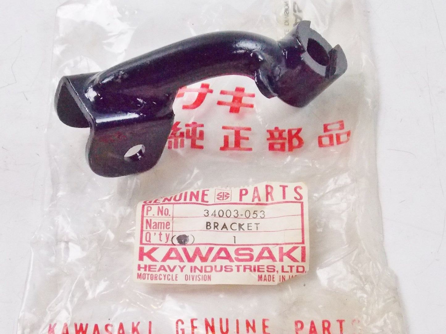 NOS KAWASAKI 1974-1978 LEFT FOOTREST BRACKET KZ400 34003-053 - MotoRaider
