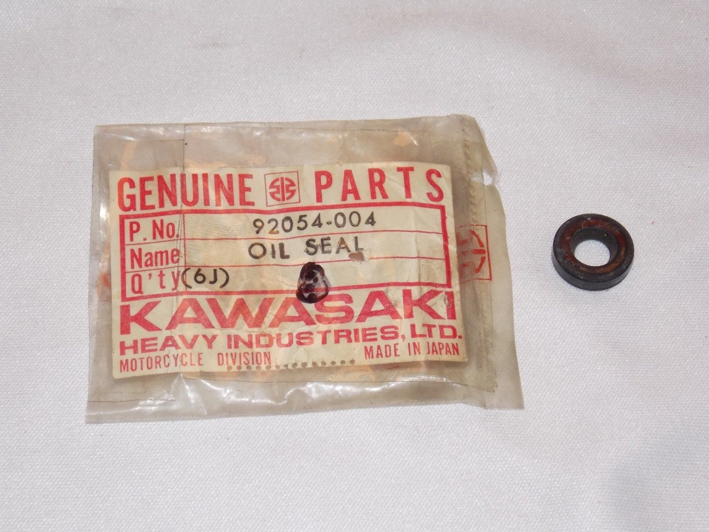 NOS KAWASAKI 1966-1978 OIL SEAL W1/2 F5-9&11 H1 KH400 KE175 92054-004 - MotoRaider