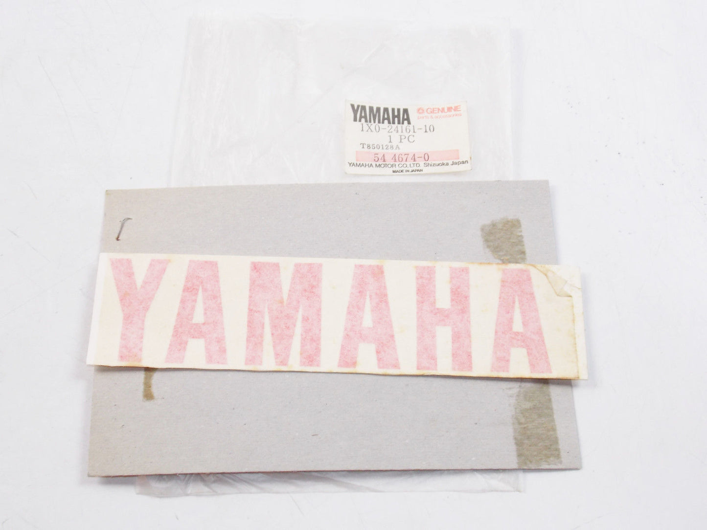 NOS OEM GENUINE TANK SIDE PANEL "YAMAHA" RED STICKER DECAL 1X0-24161-10 - MotoRaider
