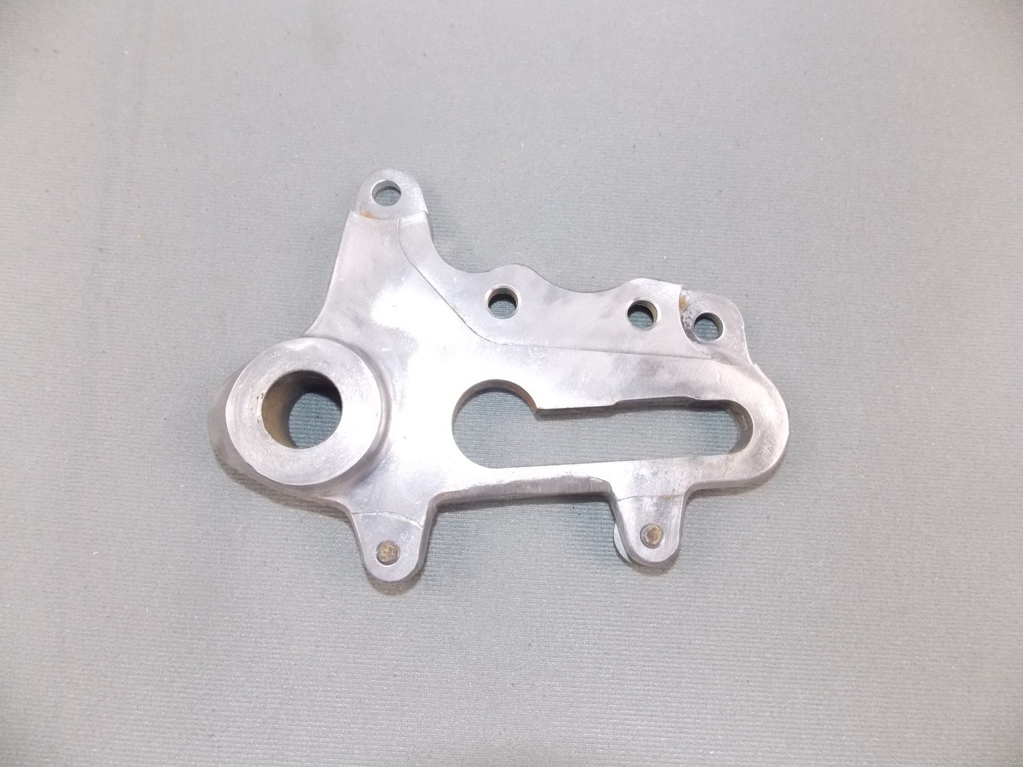 1992 KTM MXC 250 REAR WHEEL SPACER BRACKET BRAKE CALIPER HOLDER SUPPORT - MotoRaider