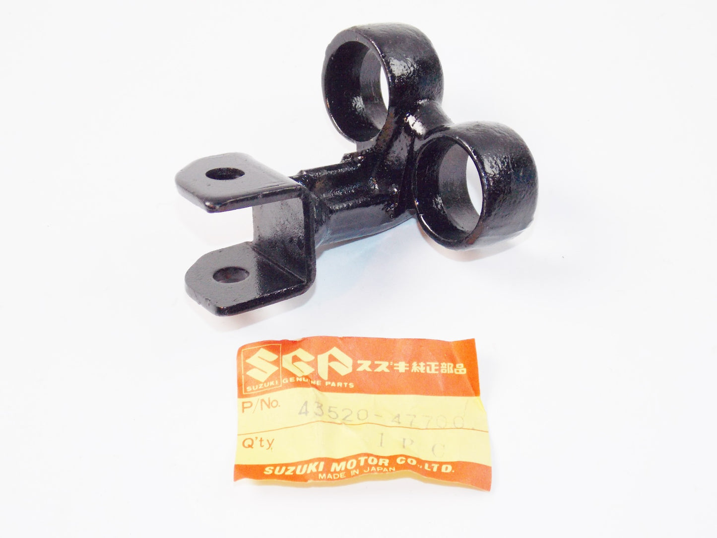 NOS OEM SUZUKI 81-82 GS550 KATANA LH FRONT FOOTREST BRACKET 43520-47700 - MotoRaider