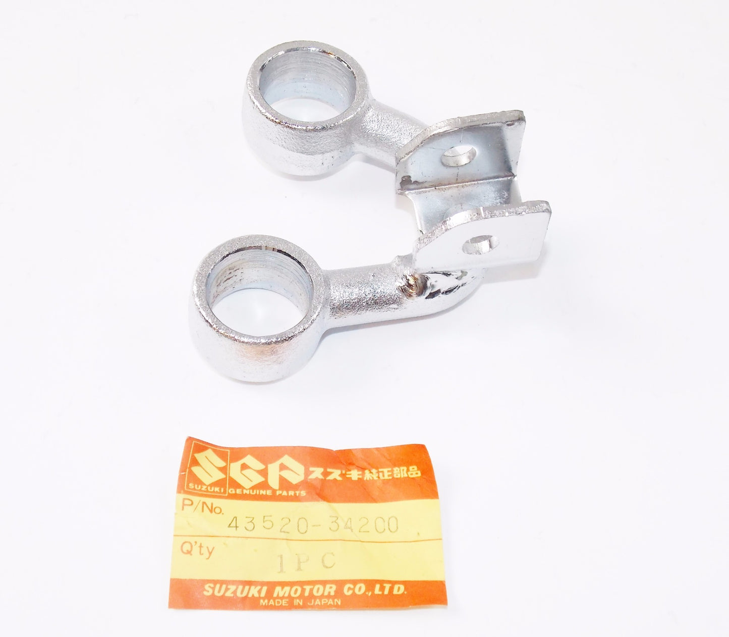 NOS OEM SUZUKI 81-82 GS 650 LH FRONT FOOTREST CHROME BRACKET 43520-34200 - MotoRaider