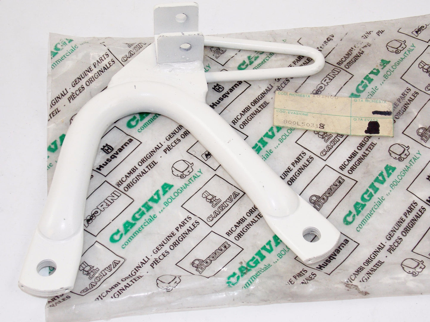 NOS OEM CAGIVA 1987-88 T4-350R/E T4-500R/E RH WHITE FOOT REST SUPPORT 800L50318 - MotoRaider