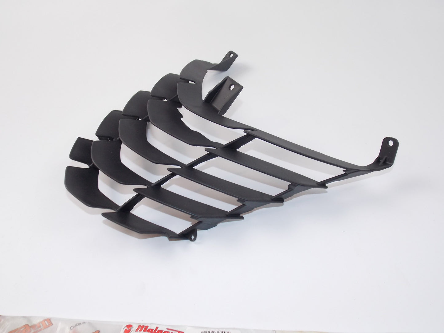 NOS OEM MALAGUTI Centro 160 / 4T - I.E. Euro 3 LOWER AIR INTAKE GRILL 071.954.03 - MotoRaider