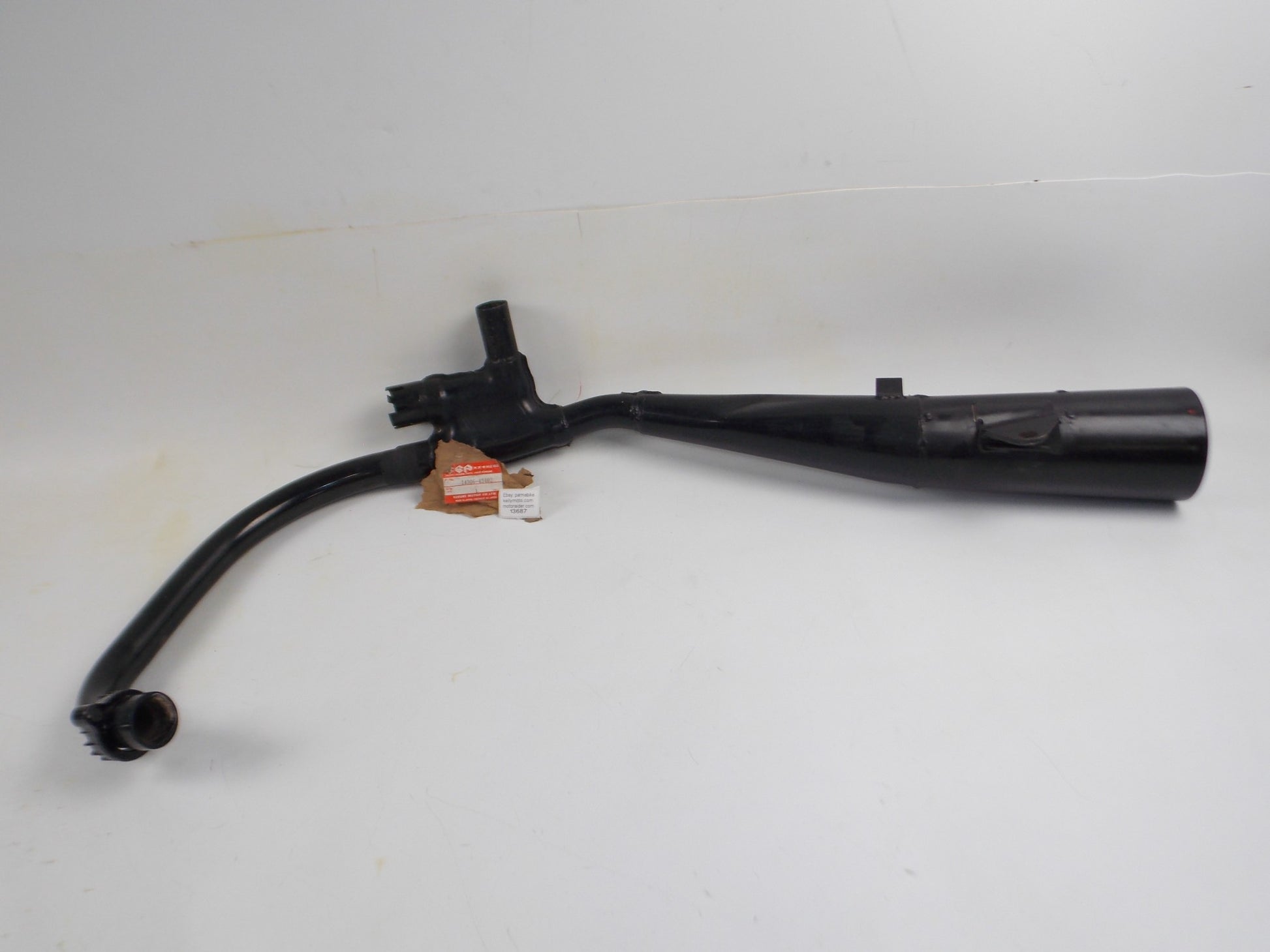 NOS OEM SUZUKI 1984-1987 GSX500E LEFT HAND EXHAUST MUFFLER PIPE # 14306-43402 - MotoRaider