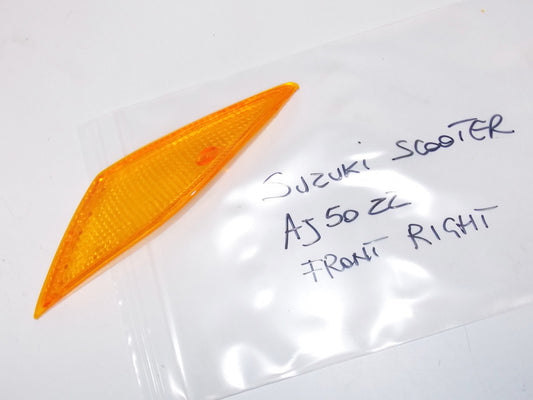 NEW SUZUKI SCOOTER 1995 AJ50 ZZ FRONT RH FLASHER TURN SIGNAL LENS 35612-25E20 - MotoRaider