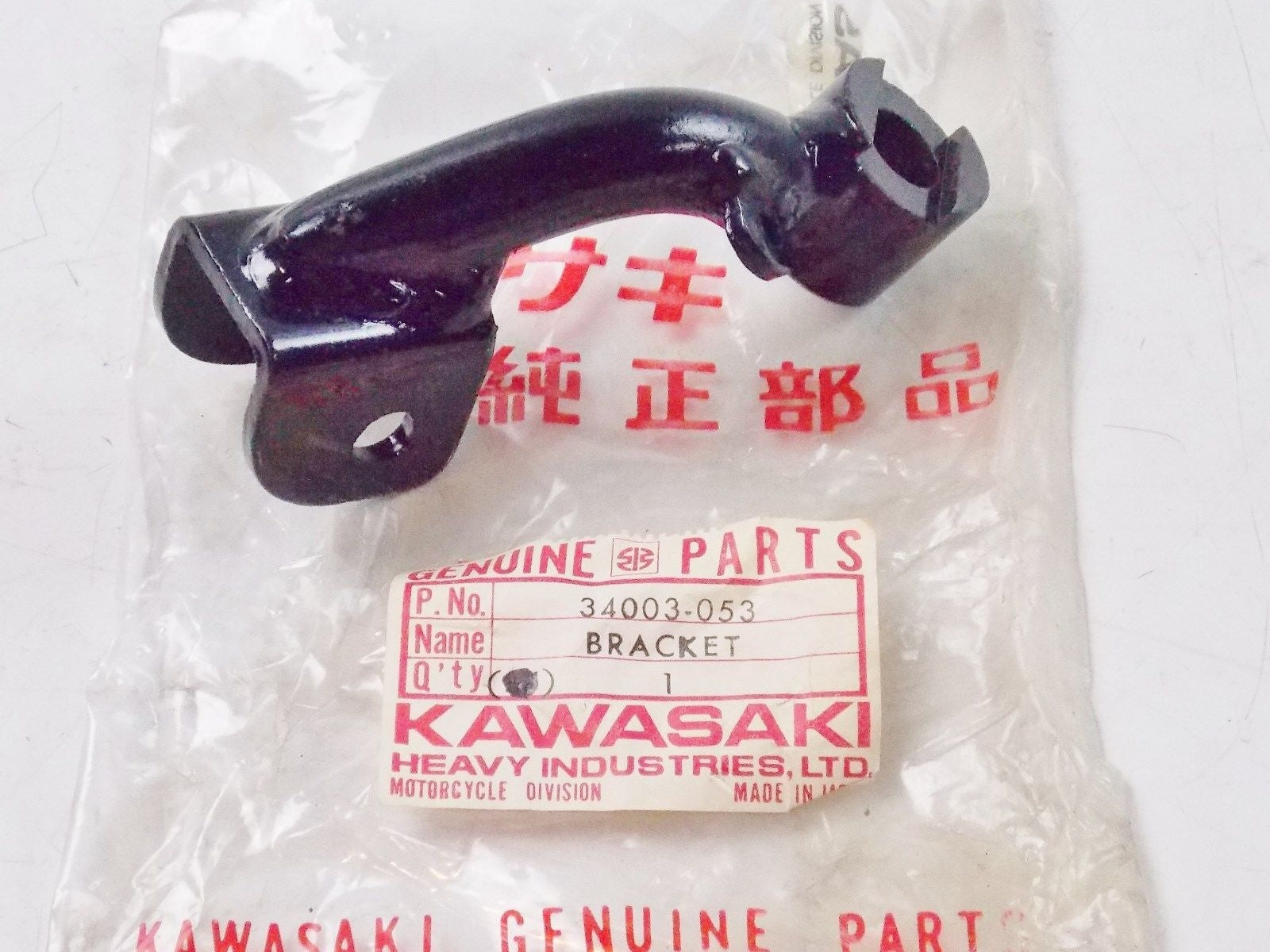 NOS KAWASAKI  1974-1978 LEFT FOOTREST BRACKET KZ400   34003-053 - MotoRaider