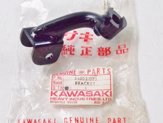 NOS KAWASAKI  1974-1978 LEFT FOOTREST BRACKET KZ400   34003-053 - MotoRaider