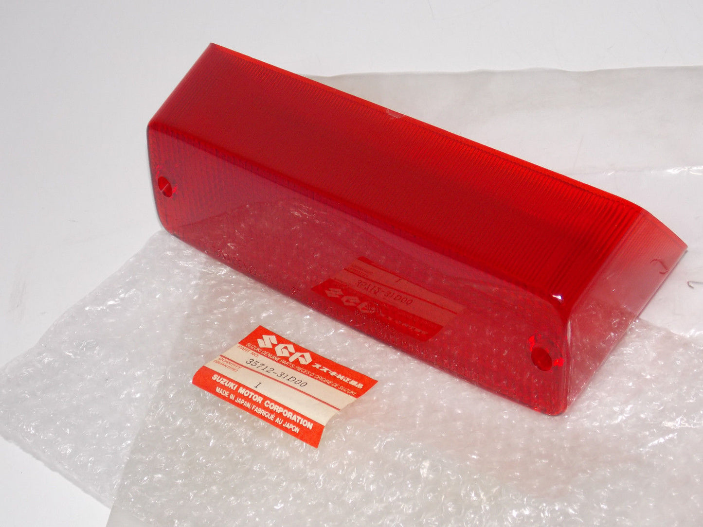 NOS OEM NEW SUZUKI 1991 1992 1993 1994 1995 1997 DR800 TAILGIHT LENS 35712-31D00 - MotoRaider