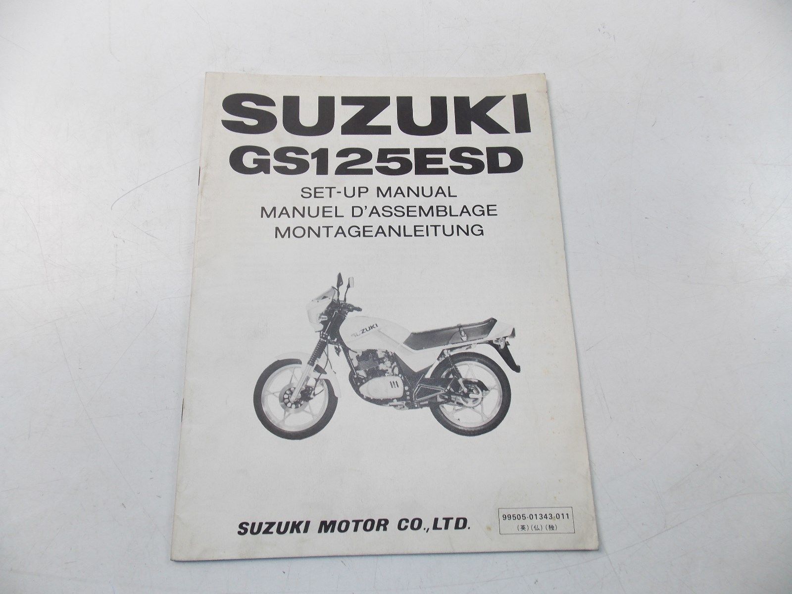 NEW SUZUKI 1982 SETUP MANUAL GS125ESD ENGLISH FRENCH GERMAN  99505-01343-011 - MotoRaider