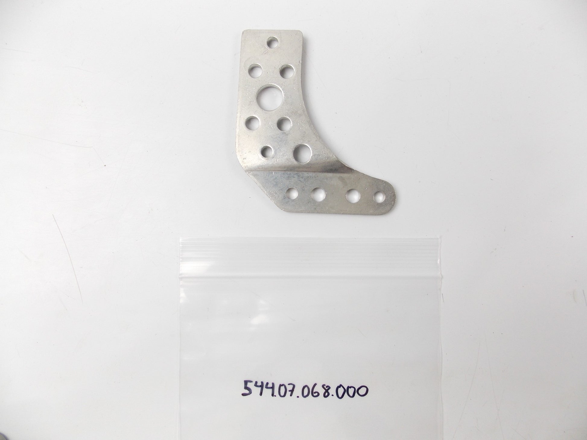 NOS OEM KTM 1986 125 MX\MXC\GS CHAIN GUIDE RETAINER PLATE 54407068000 - MotoRaider