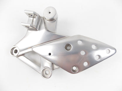 NOS OEM HONDA 2004-2010 CBR125 RIGHT FOOTREST HOLDER MOUNT PLATE 50600-KPP-901 - MotoRaider