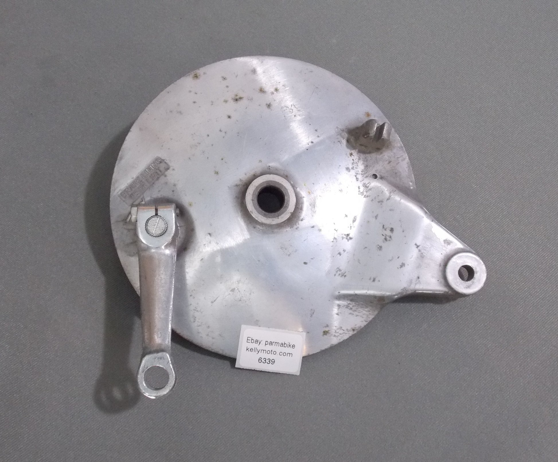 NOS OEM SUZUKI 1982 GS 450 REAR WHEEL HUB BRAKE PLATE W/ACTUATOR LEVER 200mm - MotoRaider