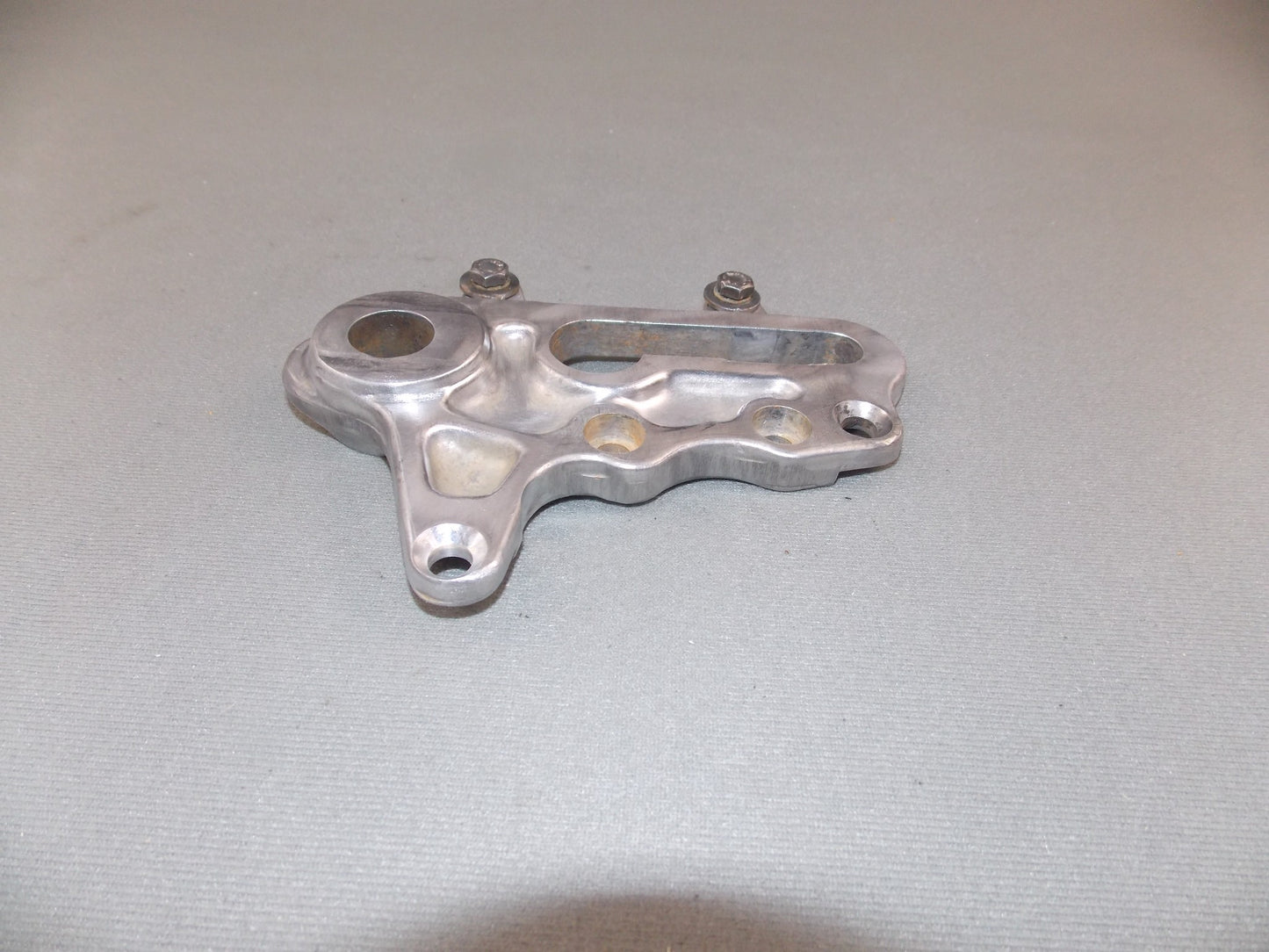 1992 KTM MXC 250 REAR WHEEL SPACER BRACKET BRAKE CALIPER HOLDER SUPPORT - MotoRaider