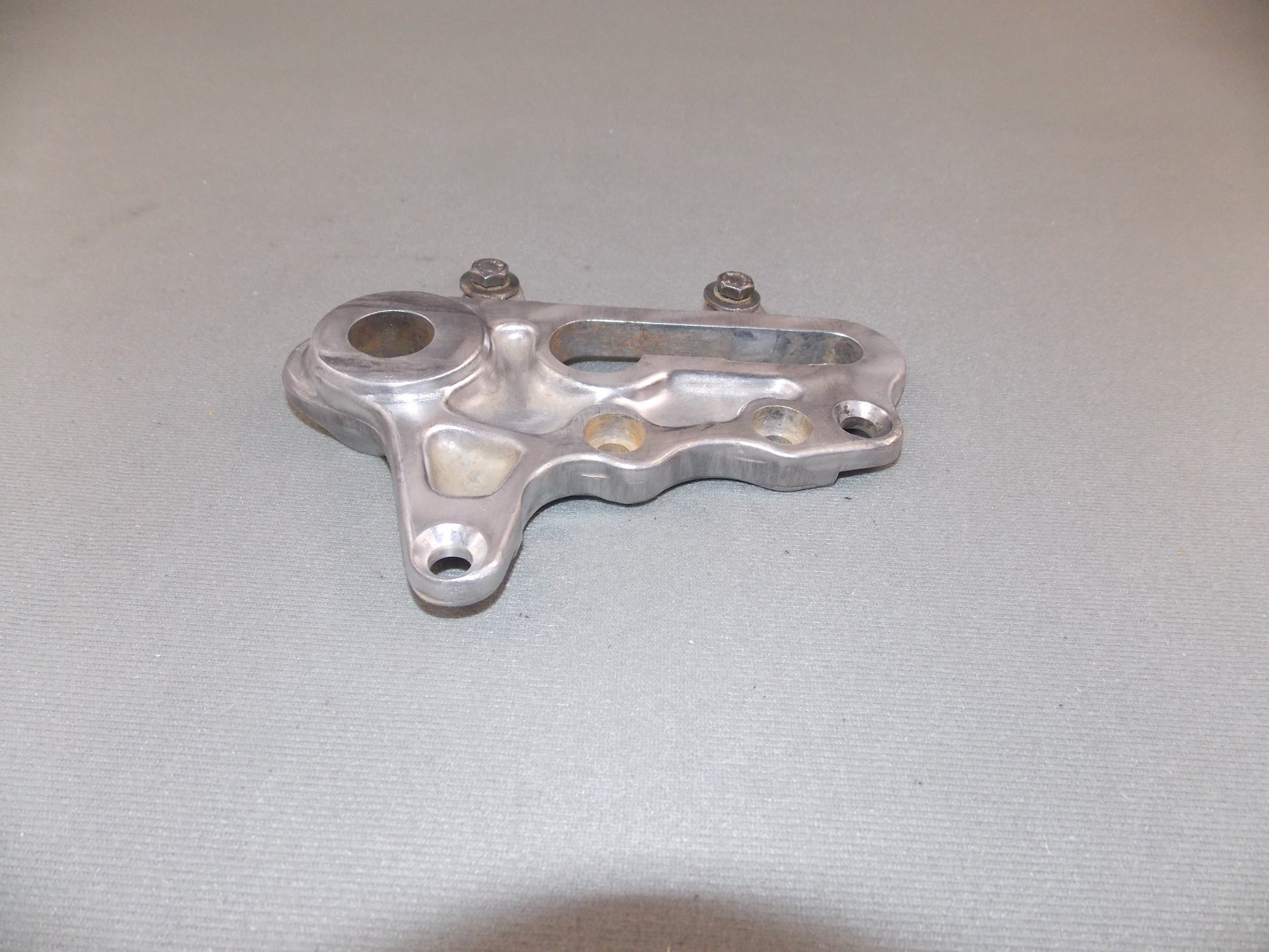 1992 KTM MXC 250 REAR WHEEL SPACER BRACKET BRAKE CALIPER HOLDER SUPPORT - MotoRaider