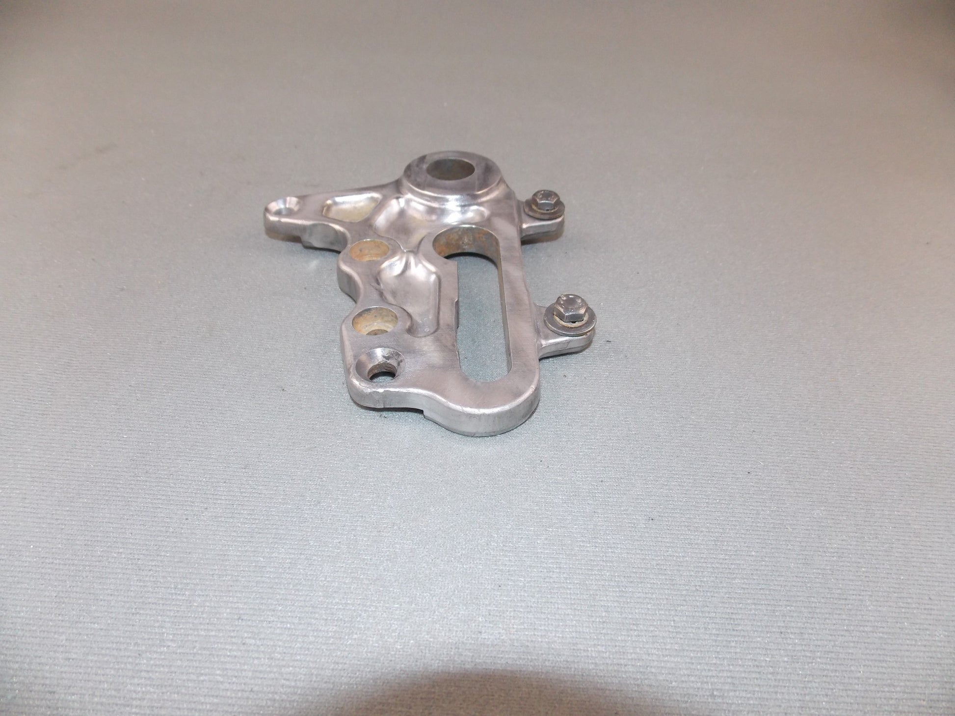 1992 KTM MXC 250 REAR WHEEL SPACER BRACKET BRAKE CALIPER HOLDER SUPPORT - MotoRaider