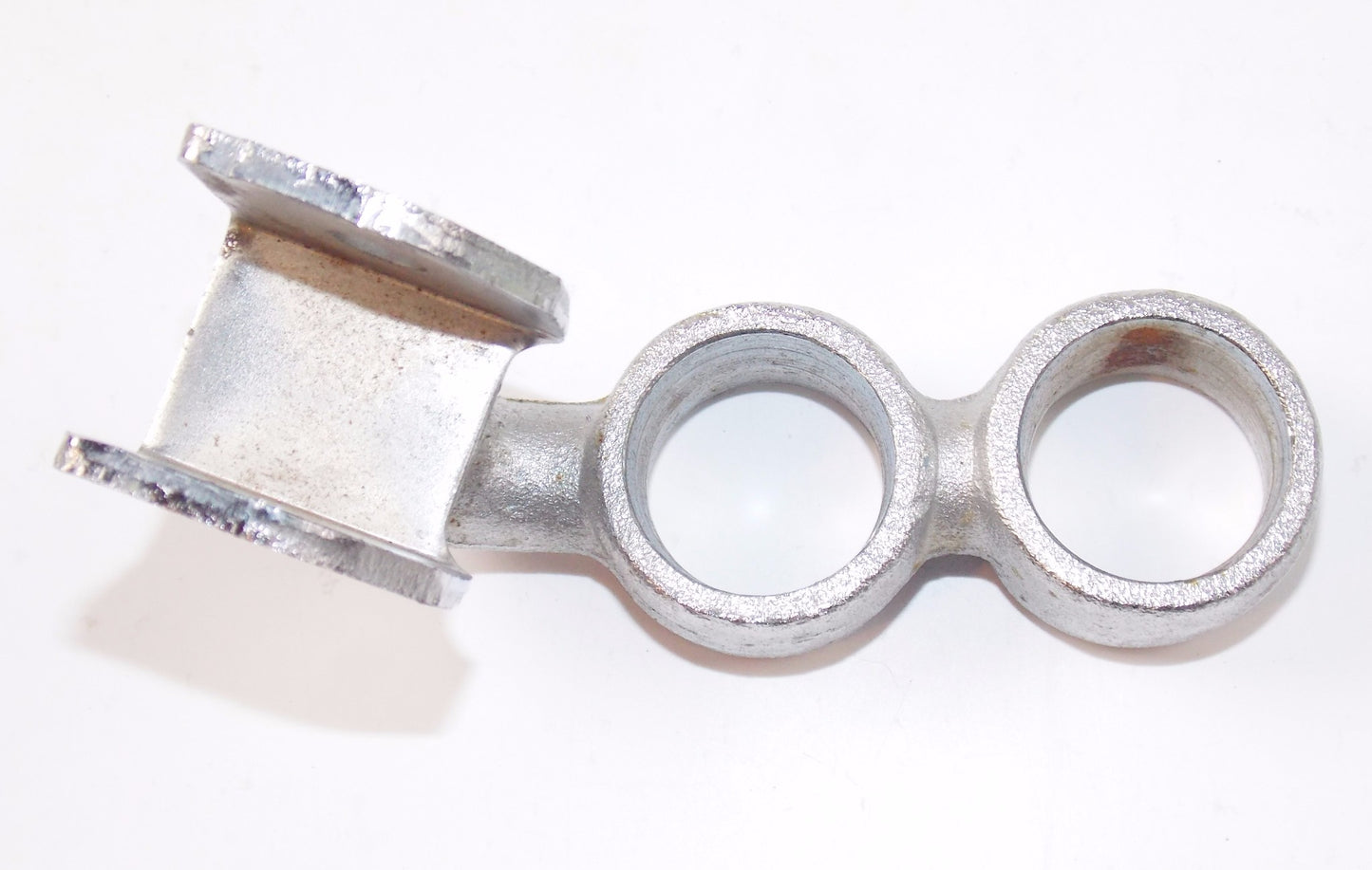 NOS OEM SUZUKI CRHOME RH FRONT FOOTREST BRACKET - MotoRaider