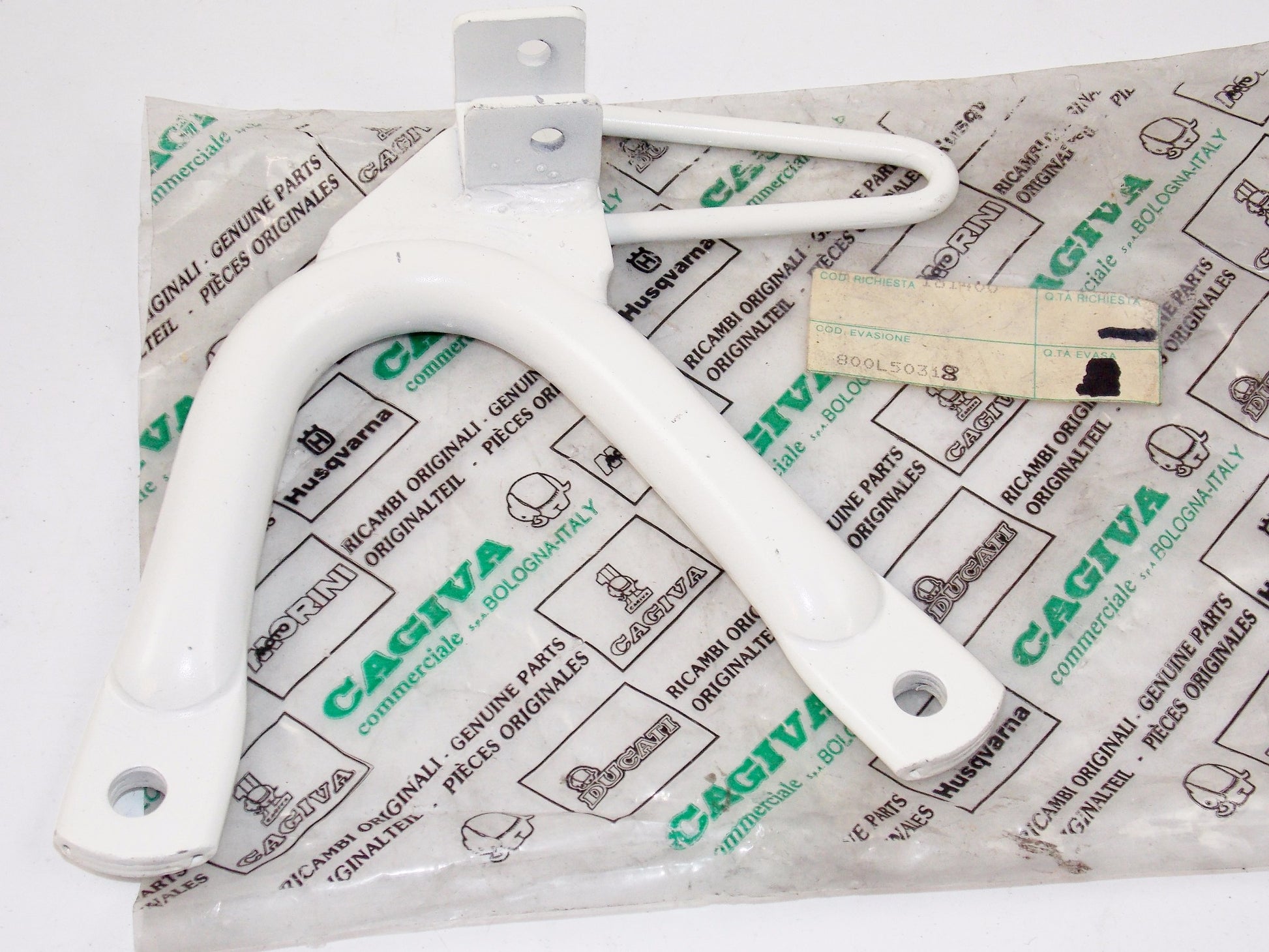 NOS OEM CAGIVA 1987-88 T4-350R/E T4-500R/E RH WHITE FOOT REST SUPPORT 800L50318 - MotoRaider