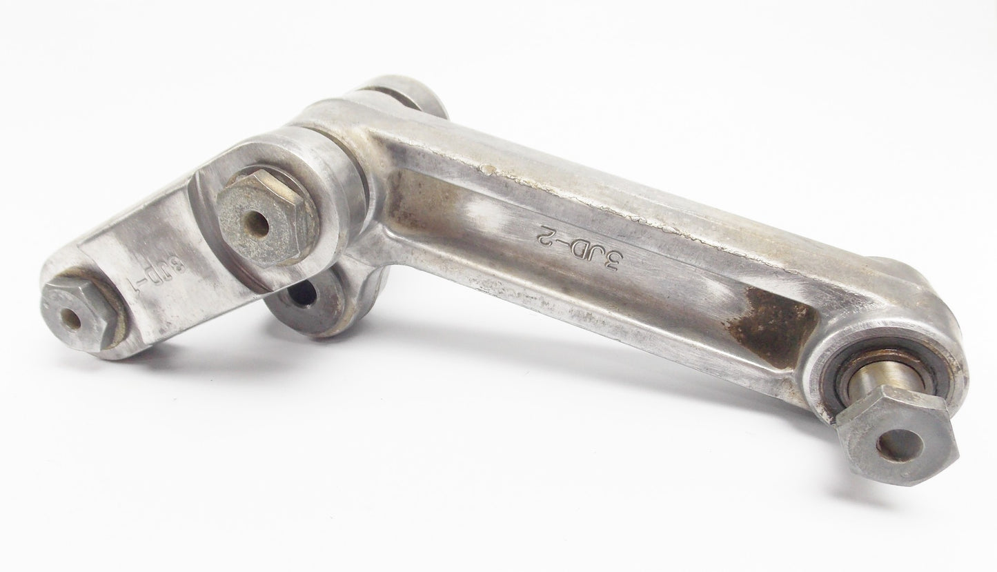 1990 YAMAHA YZ125 SWINGARM RELAY ARM SHOCK MOUNT CONNECTOR 3JD-2217F 3JD-2217A - MotoRaider